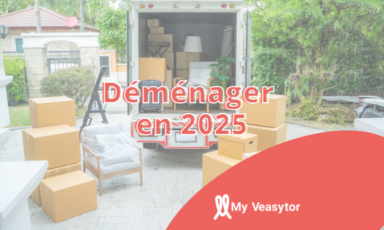 Camion de déménagement garé avec des cartons empilés devant, prêt pour un déménagement.